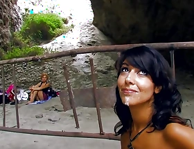 Lone camper woman watches as a young couple fucks in a cave